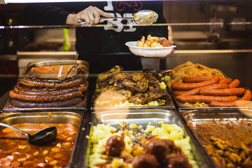 man serving hungarian food
