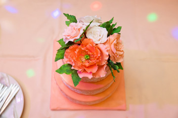 Delicious wedding cake decorated with flowers