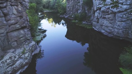 Mountain creek running between vertical rocky walls in the Carpathian in summer