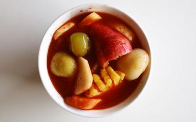 Asinan Bogor with wood background. Preserved tropical fruits served in sweet sour vinegar chili sauce.