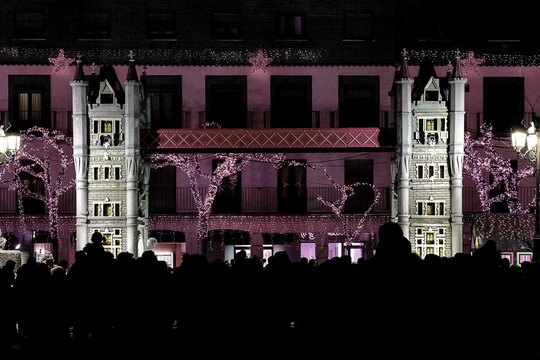 Towers In Christmas Decoration With A Crowd Of People Watching And Listening To Christmas Music