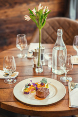 delicious beef steak with sauce and vegetable, served on white plate, modern gastronomy, michelin restaurant