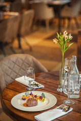 delicious beef steak with sauce and vegetable, served on white plate, modern gastronomy, michelin restaurant
