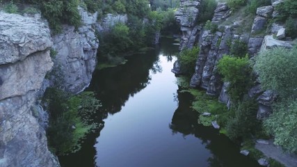 Magic mountain brook running between sharp rocks in the Carpathian in summer