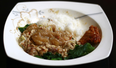 Rice, sprouting, spinach and sambal tumpang. Indonesian traditional food.