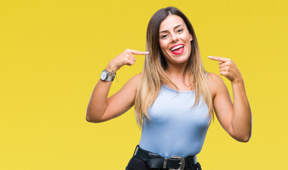 Young beautiful elegant business woman over isolated background smiling confident showing and pointing with fingers teeth and mouth. Health concept.