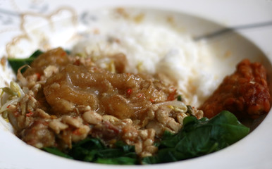 Rice, sprouting, spinach and sambal tumpang. Indonesian traditional food.