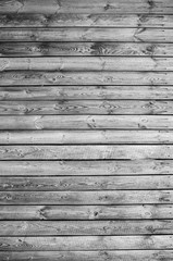 Old wooden planks in the village. Vintage countryside fence. Rustic texture background.