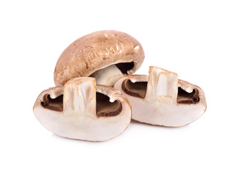 whole and half cut fresh champignon mushrooms on white background