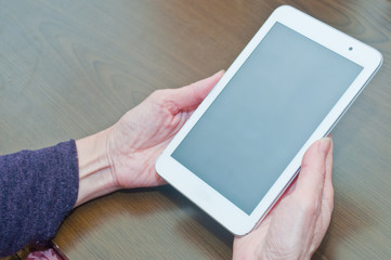 Handle the tablet at hand