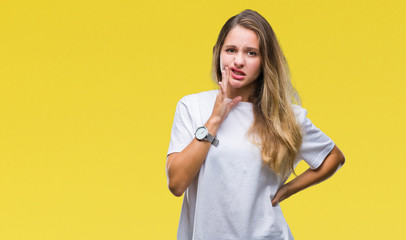 Fototapeta na wymiar Young beautiful blonde woman wearing casual white t-shirt over isolated background touching mouth with hand with painful expression because of toothache or dental illness on teeth. Dentist concept.