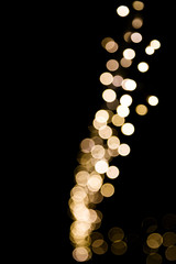 Golden abstract bokeh lights Christmas background for your design.