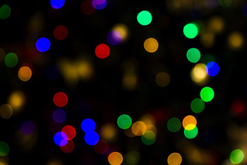 Colorful abstract bokeh lights Christmas background for your design.