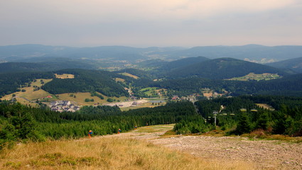 Fototapeta na wymiar Landscape from the Black Mountain, the summit with a ski slope in a small Polish tourist town in the Lower Silesia