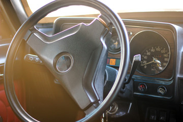 Interior view of old vintage car. Close-up steering wheel