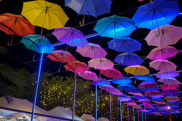 The colorful umbrella in night event outdoor in park and lighting