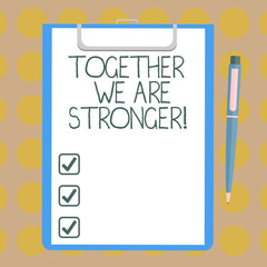 Word writing text Together We Are Stronger. Business concept for Working on a team gives best business results Blank Sheet of Bond Paper on Clipboard with Click Ballpoint Pen Text Space