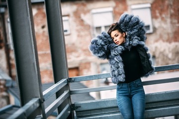 Gorgeous woman posing in luxurious fur coat