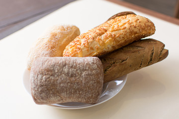Assortment of baked bread on a plate.