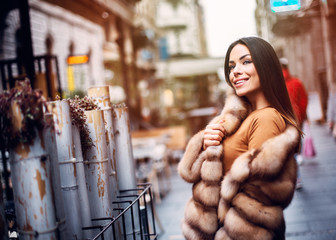 Gorgeous woman posing in luxurious fur coat