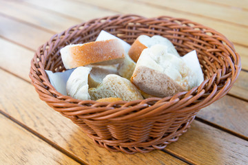 bread in basket - little roll breads in basket on table