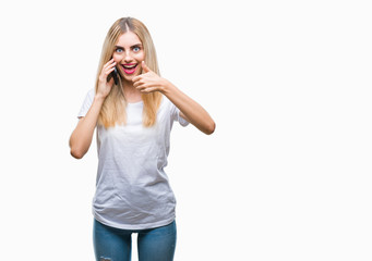 Fototapeta premium Young beautiful blonde woman talking using smartphone over isolated background happy with big smile doing ok sign, thumb up with fingers, excellent sign