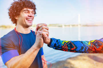 Exercise - couple giving high five to each other after workout.