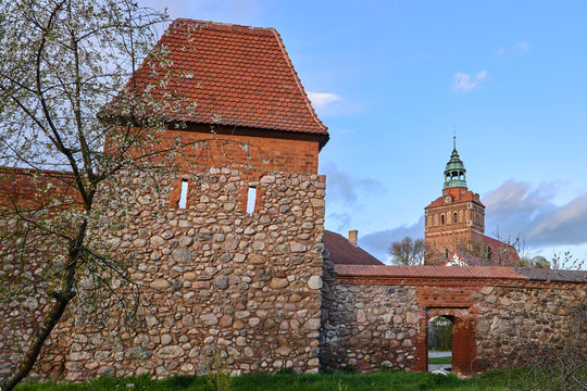 Medieval defensive walls and  Belfry of the Gothic church in Osno in Poland.