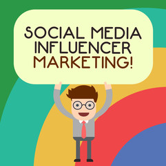 Handwriting text writing Social Media Influencer Marketing. Concept meaning Blogger online modern advertising Man Standing Holding Above his Head Blank Rectangular Colored Board