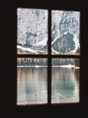 Beautiful view of autumn mountains at Braies,Italy from inside windows photoshot
