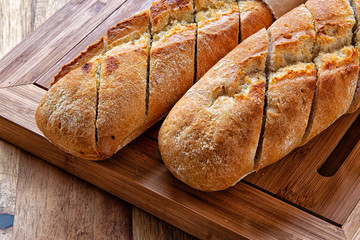 French baguette on wooden background