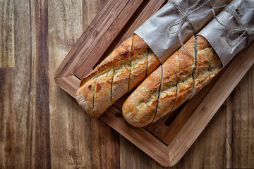 French baguette on wooden background