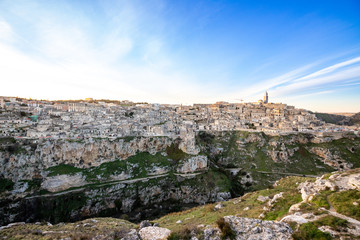 Obraz premium Panorama of Matera and Gravina seen from the archaeological park of the Murge Materane, Basilicata, Italy