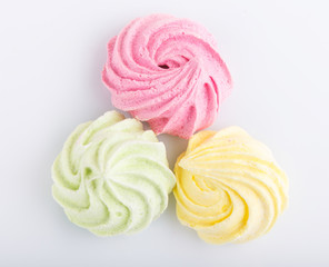 Heap of meringues  isolated on white background.