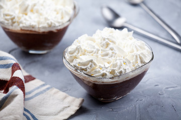 Bowls Of Chocolate Mousse With Whipped Cream