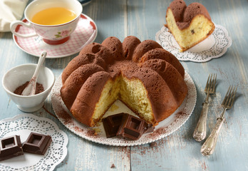 soft homemade cocoa cake with ingredients around