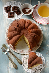 soft homemade cocoa cake with ingredients around