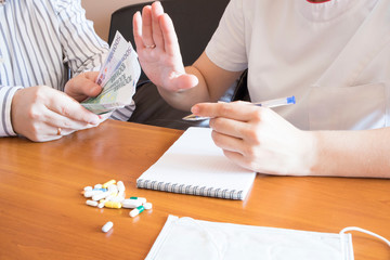 Doctor in corruption concept with being offered bribe