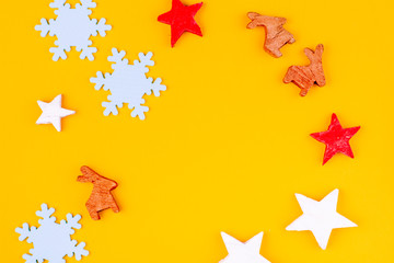 Christmas composition. Christmas yellow decorations, fir tree branches with toys gift boxes on yellow background. Flat lay, top view, copy space