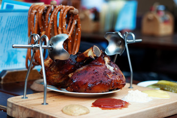 Traditional national dish 'Pig knee' ('vepřové koleno'). Shooting in daylight, shallow depth of field (selective sharpness), blurred background.