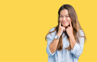 Young beautiful brunette business woman over isolated background Smiling with open mouth, fingers pointing and forcing cheerful smile