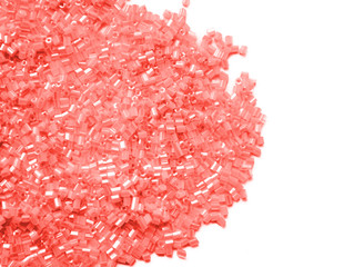 pink beads for craft on isolated background
