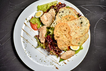 Fresh salad in plate on wooden table