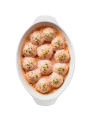 Chicken meatballs baked in creamy tomato sauce isolated with clipping path