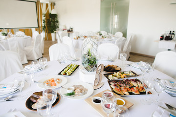 Rich white table served for a wedding dinner