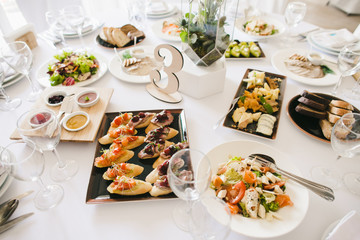 Rich white table served for a wedding dinner