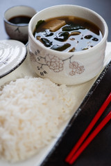 Close-up of white rice and miso soup, selective focus, vertical shot