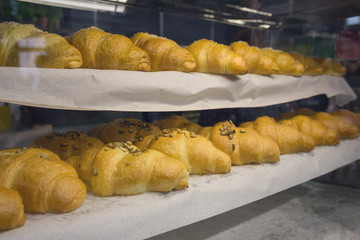 Croissants on the counter of a bakery. Bakery products
