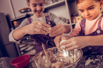Selective focus of eggs in girls hands
