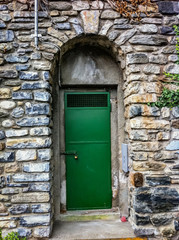 green door on stone building